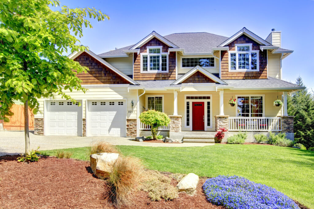 Large American beautiful house with red door.